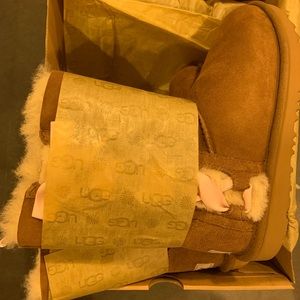 Big Girl Ugg K Pala boots in camel color and pink ribbon. Size 2